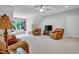 Spacious living room with comfortable seating, a TV, and a window with natural light at 216 Colonial Ridge Dr, Pittsboro, NC 27312