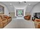 Inviting living room with cozy seating, a TV, and a window, offering a relaxing atmosphere at 216 Colonial Ridge Dr, Pittsboro, NC 27312