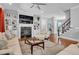 Bright living room includes fireplace, built-in bookshelves, and a cozy seating area at 216 Colonial Ridge Dr, Pittsboro, NC 27312