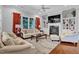 Cozy living room with fireplace, built-in shelving, and ample seating at 216 Colonial Ridge Dr, Pittsboro, NC 27312