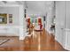 Expansive living space featuring hardwood floors, white trim, and seamless flow at 216 Colonial Ridge Dr, Pittsboro, NC 27312