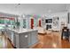 Open-concept living space showcases modern kitchen island and inviting seating area at 216 Colonial Ridge Dr, Pittsboro, NC 27312
