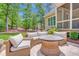 Outdoor patio with comfortable seating and a stylish fire pit table, perfect for entertaining at 216 Colonial Ridge Dr, Pittsboro, NC 27312