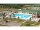 Community pool featuring a water slide, fenced perimeter and lounge chairs at 216 Colonial Ridge Dr, Pittsboro, NC 27312