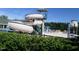 View of the water slide into the community pool, with chairs and umbrellas available at 216 Colonial Ridge Dr, Pittsboro, NC 27312
