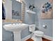 Charming powder room with elegant fixtures, a pedestal sink, and tasteful decor at 216 Colonial Ridge Dr, Pittsboro, NC 27312