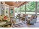 Cozy sunroom with comfortable seating, a wood ceiling, and screened windows, perfect for relaxation at 216 Colonial Ridge Dr, Pittsboro, NC 27312