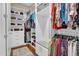 Organized walk-in closet with custom shelving and ample storage space for clothes and accessories at 216 Colonial Ridge Dr, Pittsboro, NC 27312