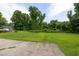 Large backyard area with lush greenery and a well-maintained lawn, perfect for outdoor enjoyment at 2315 Oxford Rd, Henderson, NC 27536