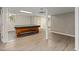 Basement game room with stylish vinyl floors, pool table and natural light at 2315 Oxford Rd, Henderson, NC 27536