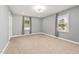 Neutral bedroom with carpet, recessed lighting, and a window at 2315 Oxford Rd, Henderson, NC 27536