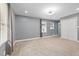 Large bedroom featuring carpet floors, neutral walls, and a closet at 2315 Oxford Rd, Henderson, NC 27536