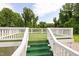 White railed deck overlooking trees and greenery at 2315 Oxford Rd, Henderson, NC 27536