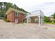Charming brick home with a unique, elevated deck and ample parking space out front at 2315 Oxford Rd, Henderson, NC 27536
