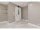 Bright foyer features marble tile floors and front door with decorative glass at 2315 Oxford Rd, Henderson, NC 27536