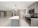 Beautiful kitchen featuring grey cabinets, an island, and modern appliances at 2315 Oxford Rd, Henderson, NC 27536