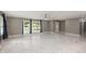Open living room featuring tile floors, neutral walls, recessed lighting, and natural light at 2315 Oxford Rd, Henderson, NC 27536