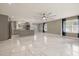 Open-concept living space featuring marble floors, modern lighting, and natural light at 2315 Oxford Rd, Henderson, NC 27536