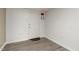 Room with a door and a grey vinyl floor at 2315 Oxford Rd, Henderson, NC 27536
