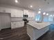 Modern kitchen features granite countertops, stainless appliances, and a convenient center island at 243 New Twin Br Ct, Smithfield, NC 27577