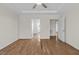 Spacious bedroom with hardwood floors and multiple doorways leading to other rooms at 25 Mannford Ln, Angier, NC 27501