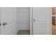 Pantry with wire shelving for optimal storage and organization, located in the kitchen area at 25 Mannford Ln, Angier, NC 27501