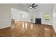 Bright living room with hardwood floors, a ceiling fan, and a fireplace at 25 Mannford Ln, Angier, NC 27501
