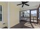 Relaxing screened porch with wooden floors and a ceiling fan, perfect for outdoor enjoyment at 25 Mannford Ln, Angier, NC 27501