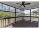Inviting screened porch offers a serene view of the lush landscaping and a peaceful pond at 25 Mannford Ln, Angier, NC 27501