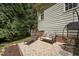 Cozy backyard featuring a seating area, pea gravel and a charming hanging chair at 2709 Penfold Ln, Wake Forest, NC 27587