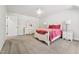 Bright bedroom with neutral carpet, white furniture including 2 night stands and a dresser at 2709 Penfold Ln, Wake Forest, NC 27587