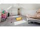 Bright, spacious bonus room with a gymnastic bar, toys and natural light from a skylight at 2709 Penfold Ln, Wake Forest, NC 27587