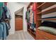 Custom closet with wood shelving and drawers for optimal organization and storage at 2709 Penfold Ln, Wake Forest, NC 27587