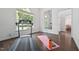 Bright exercise room with a treadmill, yoga mat and mirror, offering a dedicated workout space at 2709 Penfold Ln, Wake Forest, NC 27587