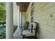 Cozy front porch seating area with decorative pillows, perfect for relaxing outdoors at 2709 Penfold Ln, Wake Forest, NC 27587