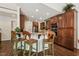 Spacious kitchen featuring custom cabinets, stainless appliances, and a breakfast bar with seating at 2709 Penfold Ln, Wake Forest, NC 27587