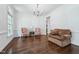 Spacious living room featuring beautiful hardwood floors and a comfortable seating arrangement at 2709 Penfold Ln, Wake Forest, NC 27587