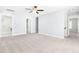 Bedroom with neutral carpet, light-gray walls, and access to laundry room at 2727 Masonboro Ferry Dr, Apex, NC 27502