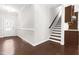 Inviting foyer with hardwood floors and staircase next to dining area at 2727 Masonboro Ferry Dr, Apex, NC 27502