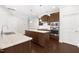 Bright kitchen showcasing granite countertops, a kitchen island, and modern appliances at 2727 Masonboro Ferry Dr, Apex, NC 27502