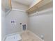 Unfinished laundry room featuring tile flooring, laundry hookups, and a water pan at 2727 Masonboro Ferry Dr, Apex, NC 27502