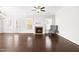 Bright living room with fireplace, hardwood floors, and view to outside the glass doors at 2727 Masonboro Ferry Dr, Apex, NC 27502