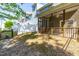 Exterior view showing a screened porch with access to a well-kept backyard at 2727 Masonboro Ferry Dr, Apex, NC 27502