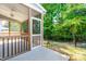 Inviting screened porch with access door and view of the landscaped backyard at 2727 Masonboro Ferry Dr, Apex, NC 27502