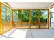 Enjoy this screened porch with ceiling fan and view of lush, green backyard at 2727 Masonboro Ferry Dr, Apex, NC 27502