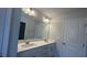 Bathroom with a double sink vanity and a large mirror at 3112 Star Gazing Ln, Durham, NC 27703