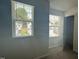 Bedroom featuring neutral walls, plush carpet, and dual windows with bright natural light at 3112 Star Gazing Ln, Durham, NC 27703