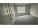 Bedroom featuring neutral walls, plush carpet, and window with natural light at 3112 Star Gazing Ln, Durham, NC 27703