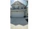 Two-story home featuring a two-car garage, a modern design, and manicured landscaping at 3112 Star Gazing Ln, Durham, NC 27703