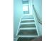 A staircase with wood treads, white risers, and a wooden handrail leads to the upper level at 3112 Star Gazing Ln, Durham, NC 27703